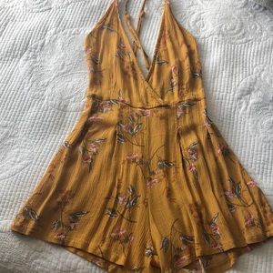 Cute orange floral romper. Thin layer. Super cute!